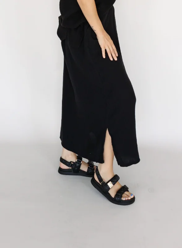 Ruffle skirt – Skirt with ruffled edges or layers, adding movement and texture.Ruffle skirt – Skirt with ruffled edges or layers, adding movement and texture.Tranquility Skirt - Black - Final Sale Ruffle skirt – Skirt with ruffled edges or layers, adding movement and texture.Ruffle skirt – Skirt with ruffled edges or layers, adding movement and texture.Tranquility Skirt - Black - Final Sale